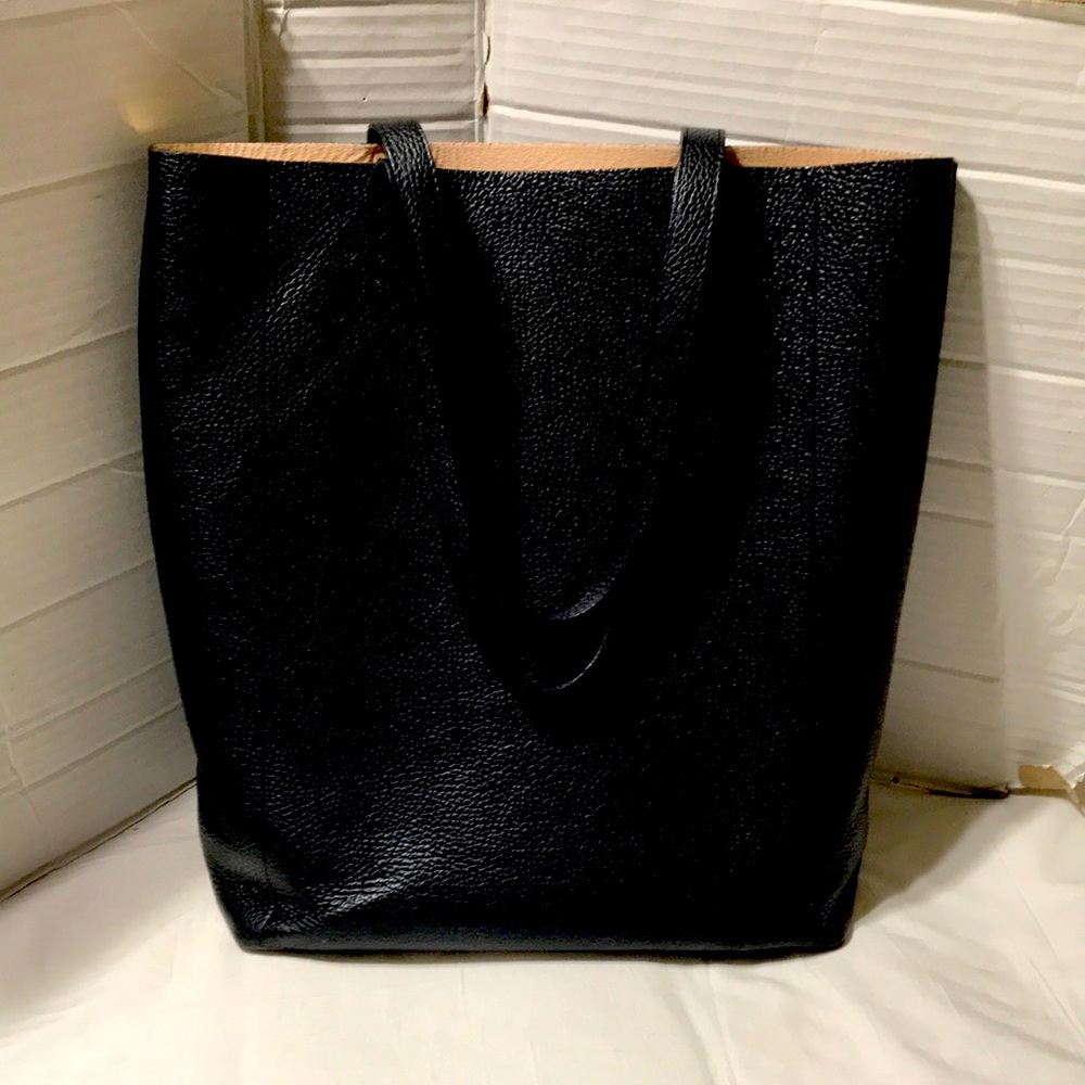 Guyana pebble leather tall tote with 2 main compartments and slip pocket. EUC